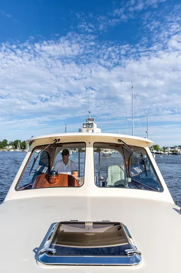 Gracious Yacht Photos Pics Hinckley Picnic Boat Mark III, 2011, cruising on a sunny day with clear skies.