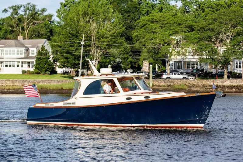 Gracious Yacht Photos Pics 2011 Hinckley Picnic Boat Mark III cruising on a scenic waterway.