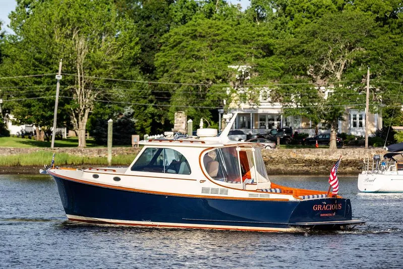 Gracious Yacht Photos Pics 2011 Hinckley Picnic Boat Mark III cruising on a scenic river.