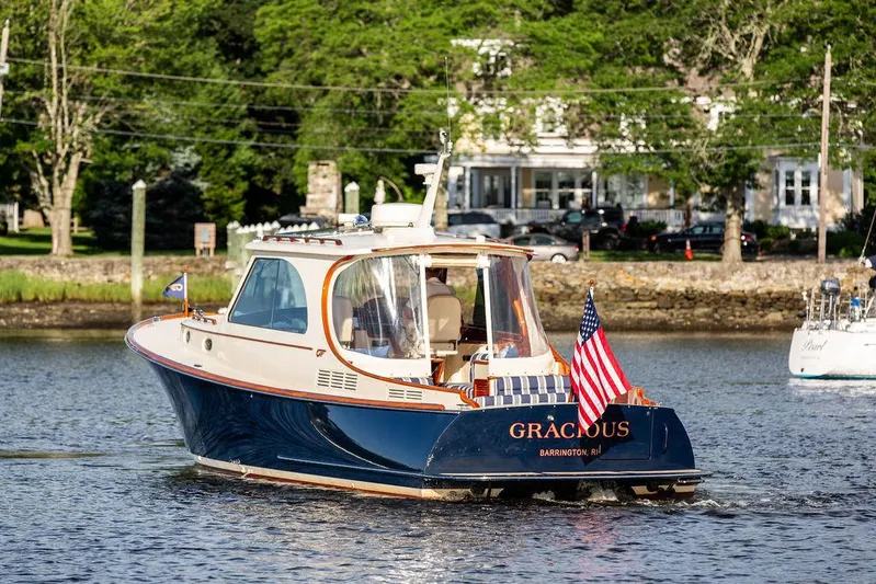 Gracious Yacht Photos Pics 2011 Hinckley Picnic Boat Mark III cruising on a scenic waterway.