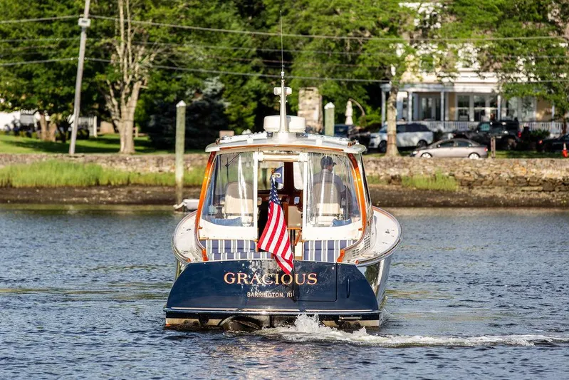 Gracious Yacht Photos Pics 2011 Hinckley Picnic Boat Mark III cruising on a scenic waterway.