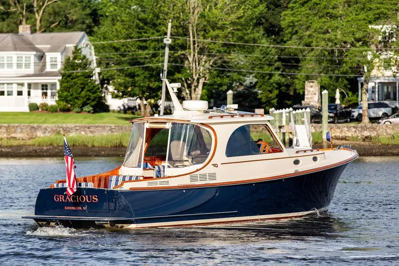 Gracious Yacht Photos Pics 2011 Hinckley Picnic Boat Mark III cruising on a scenic river.
