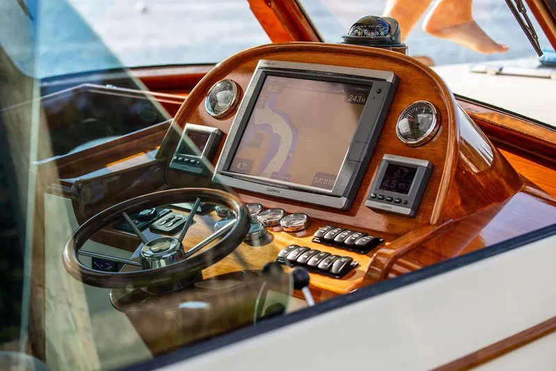 Gracious Yacht Photos Pics Hinckley Picnic Boat Mark III 2011 dashboard with navigation system and wooden finish.