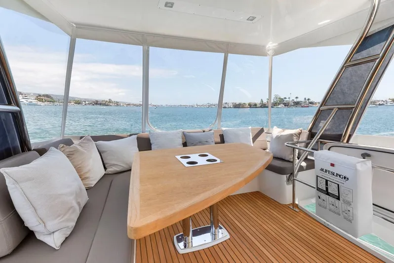 Florita Yacht Photos Pics Luxurious 2016 Prestige 550 yacht interior with elegant seating and scenic ocean view.