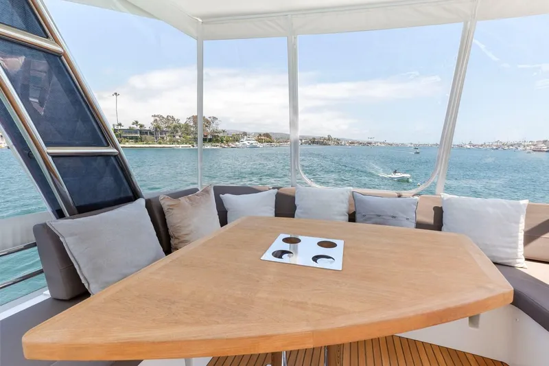 Florita Yacht Photos Pics Luxurious 2016 Prestige 550 yacht interior with scenic ocean view and comfortable seating.