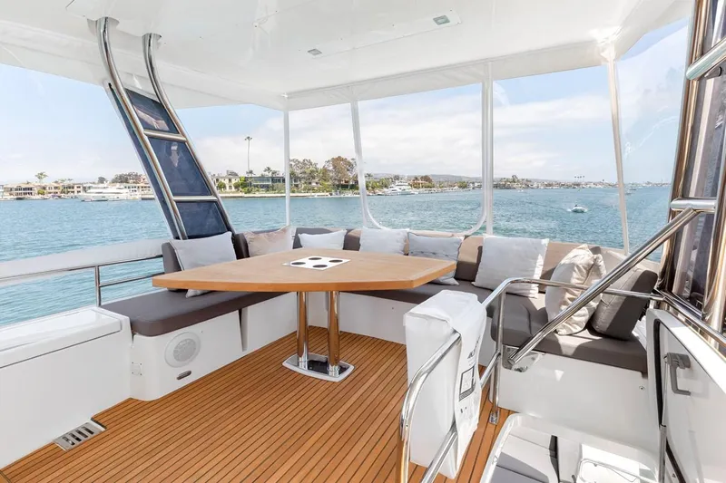 Florita Yacht Photos Pics Luxurious 2016 Prestige 550 yacht interior with elegant seating and scenic ocean view.
