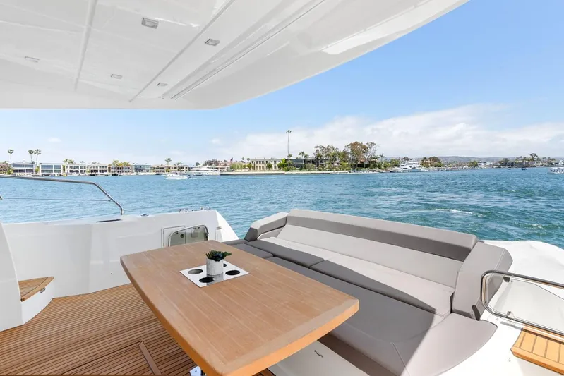 Florita Yacht Photos Pics Luxury 2016 Prestige 550 yacht with spacious deck and scenic waterfront view.