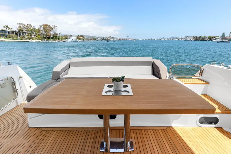 Florita Yacht Photos Pics Prestige 550 yacht deck with table, ocean view, 2016 model.