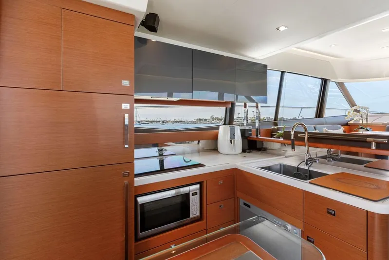 Florita Yacht Photos Pics Modern kitchen interior on 2016 Prestige 550 yacht with sleek cabinetry and appliances.
