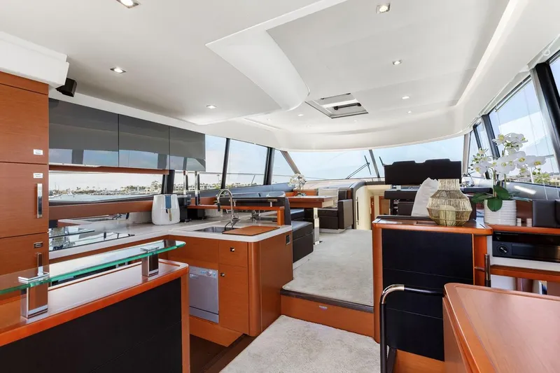 Florita Yacht Photos Pics Luxurious interior of 2016 Prestige 550 yacht with modern kitchen and seating area.