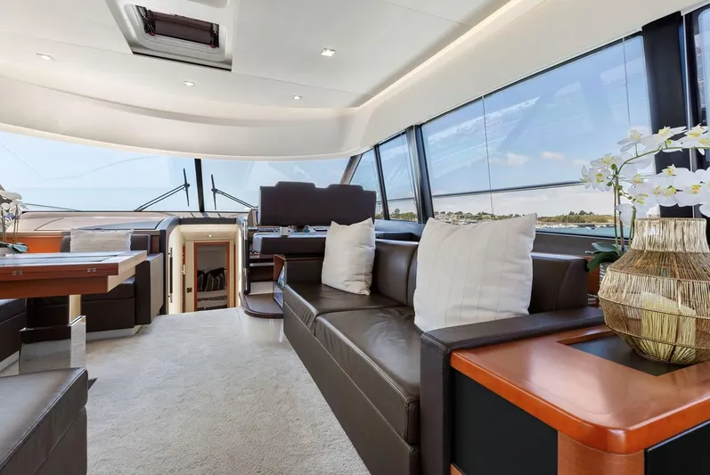 Florita Yacht Photos Pics Luxurious interior of 2016 Prestige 550 yacht with elegant seating and panoramic windows.