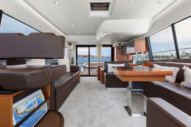 Florita Yacht Photos Pics Luxurious interior of 2016 Prestige 550 yacht with modern furnishings and panoramic windows.