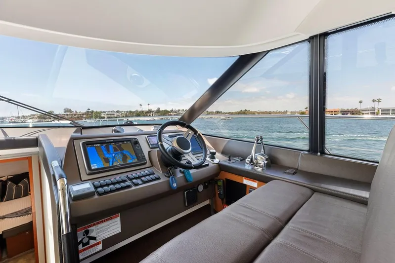 Florita Yacht Photos Pics Interior view of 2016 Prestige 550 yacht cockpit with navigation system.