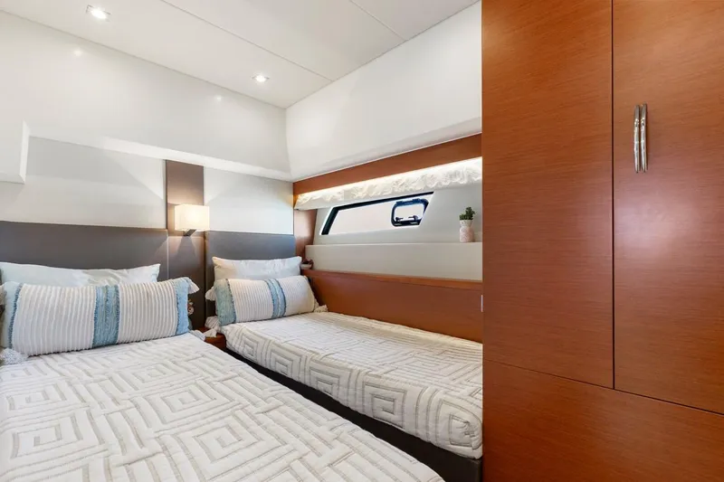 Florita Yacht Photos Pics Luxurious cabin interior of 2016 Prestige 550 yacht with twin beds and modern decor.