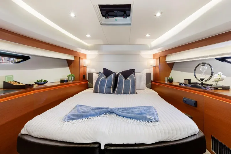Florita Yacht Photos Pics Luxurious cabin interior of 2016 Prestige 550 yacht with elegant bedding and decor.