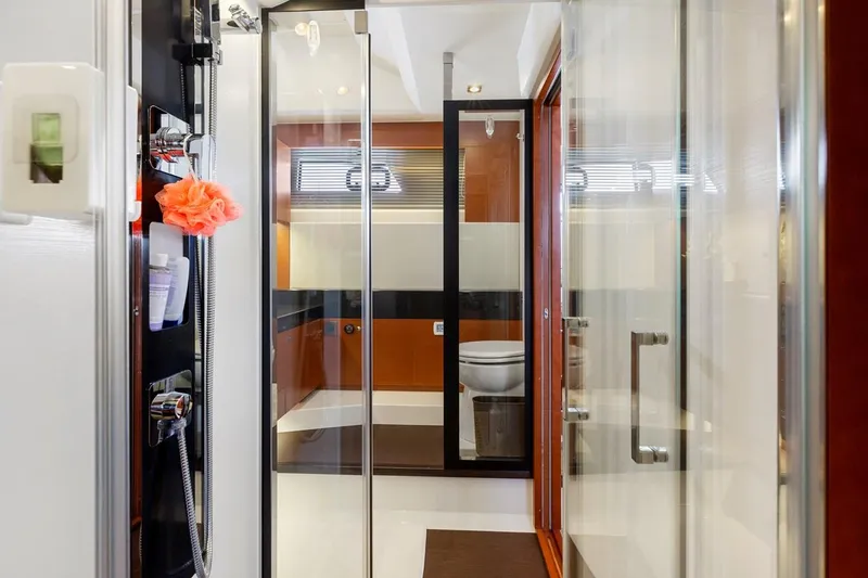 Florita Yacht Photos Pics Luxurious bathroom interior of 2016 Prestige 550 yacht with modern fixtures and glass shower.