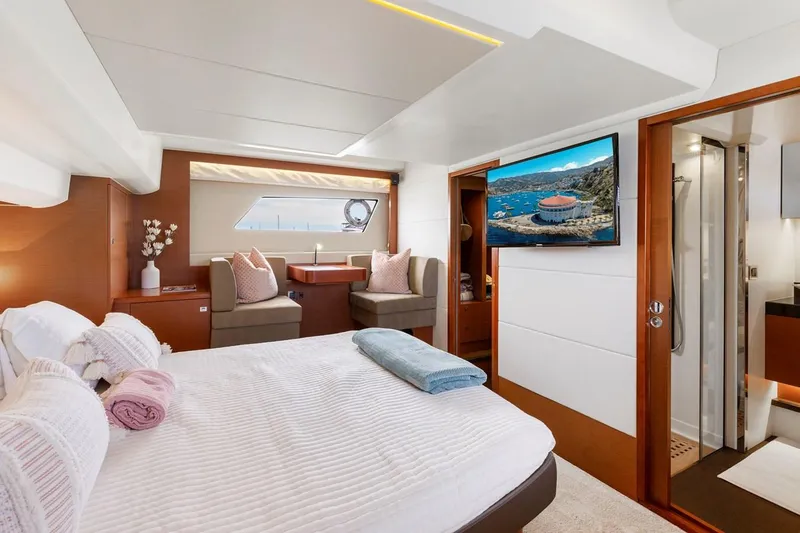 Florita Yacht Photos Pics Luxurious 2016 Prestige 550 yacht bedroom with modern decor and scenic window view.