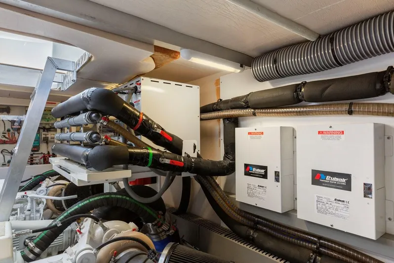 Florita Yacht Photos Pics Engine room of 2016 Prestige 550 yacht with complex wiring and equipment.