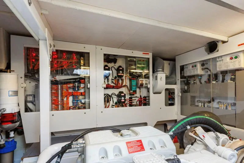 Florita Yacht Photos Pics Engine room of 2016 Prestige 550 yacht with electrical panels and machinery.