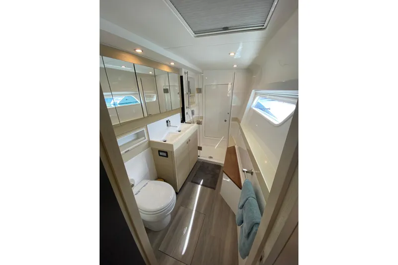 Weihaii Yacht Photos Pics Luxurious bathroom in 2023 Xquisite Yachts X5 PLUS, featuring modern fixtures and ample storage.