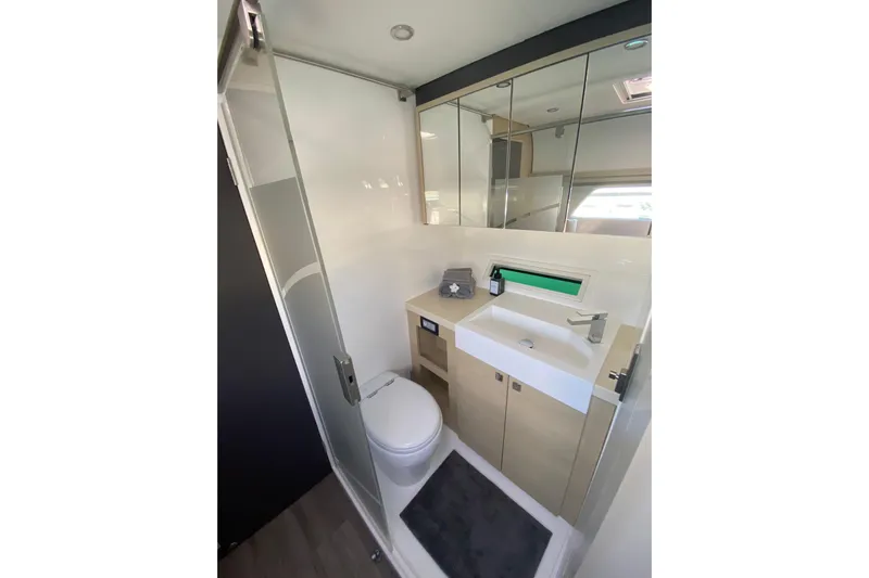 Weihaii Yacht Photos Pics Modern bathroom in 2023 Xquisite Yachts X5 PLUS, featuring sleek fixtures and ample storage.