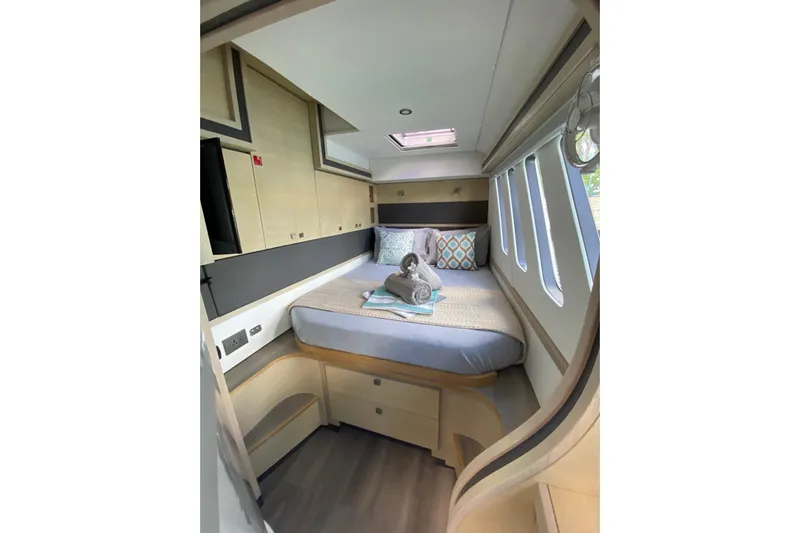 Weihaii Yacht Photos Pics Luxurious 2023 Xquisite Yachts X5 PLUS cabin interior with cozy bed and modern design.