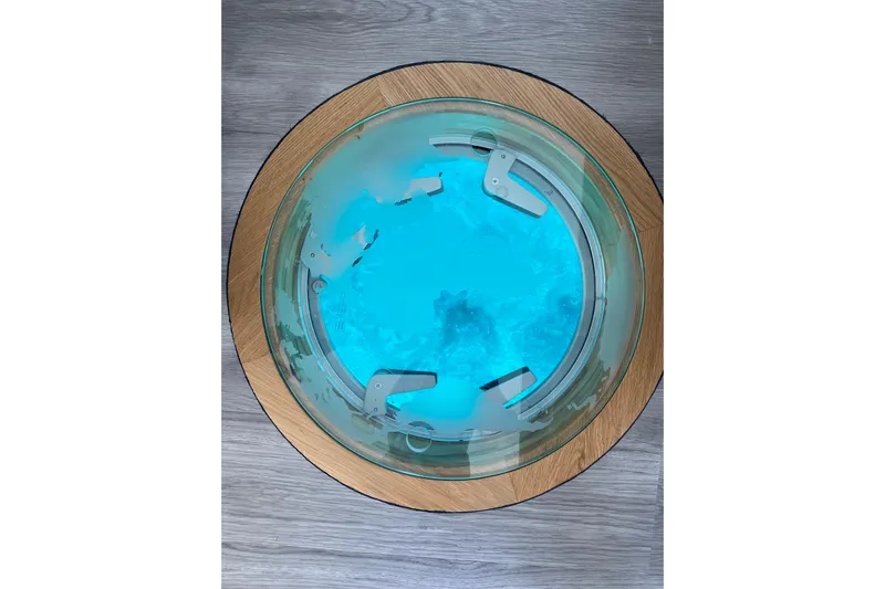 Weihaii Yacht Photos Pics Circular glass floor panel on 2023 Xquisite Yachts X5 PLUS, showcasing underwater view.