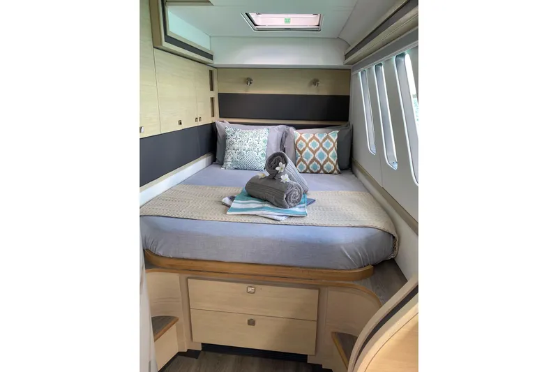 Weihaii Yacht Photos Pics Luxurious 2023 Xquisite Yachts X5 PLUS cabin with elegant bedding and modern design.