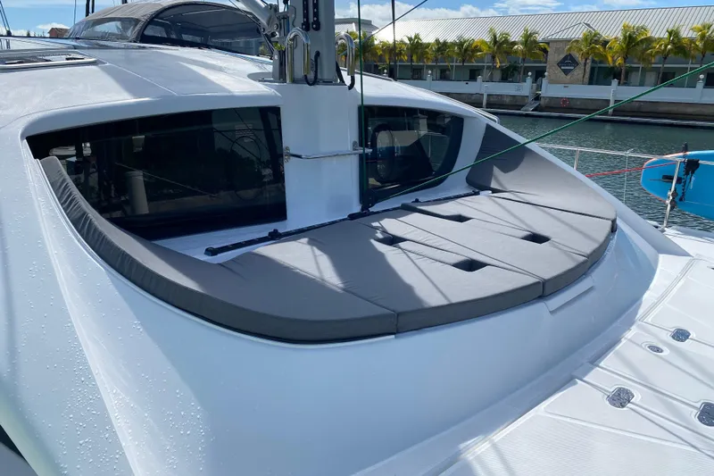 Weihaii Yacht Photos Pics 2023 Xquisite Yachts X5 PLUS deck with cushioned seating and sleek design.