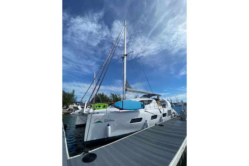 Weihaii Yacht Photos Pics 2023 Xquisite Yachts X5 PLUS catamaran docked under a clear blue sky.