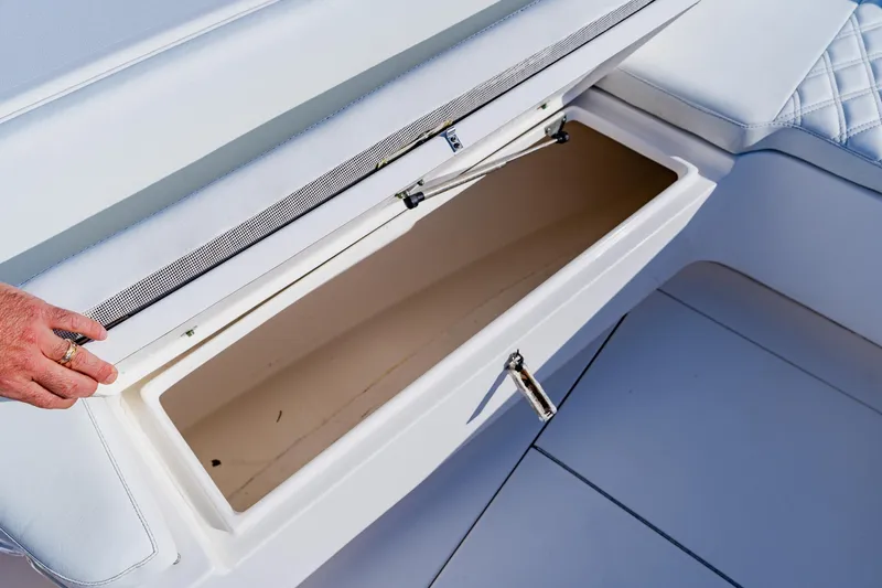 Yacht Photos Pics Open storage compartment on 2025 Contender 32 ST boat, showcasing interior space.