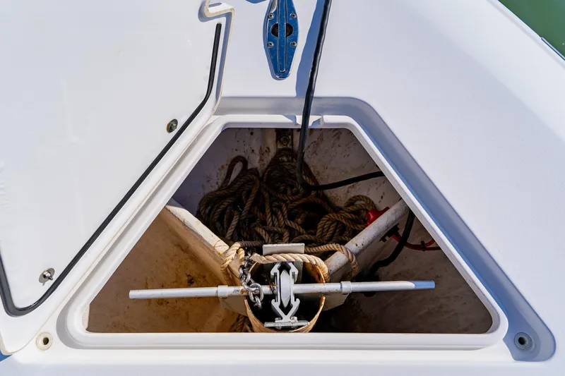  Yacht Photos Pics Anchor storage compartment on 2025 Contender 32 ST boat, featuring ropes and anchor equipment.