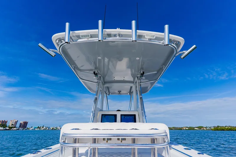  Yacht Photos Pics 2025 Contender 32 ST boat on water, featuring sleek design and advanced technology.