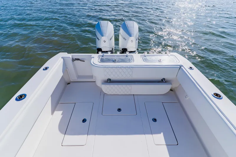  Yacht Photos Pics 2025 Contender 32 ST boat deck with dual engines on open water.