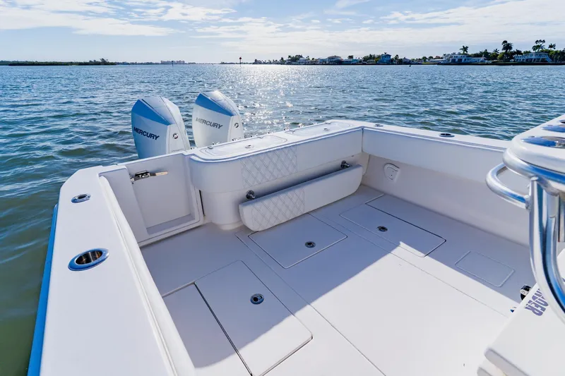  Yacht Photos Pics 2025 Contender 32 ST boat with dual Mercury engines on calm water.