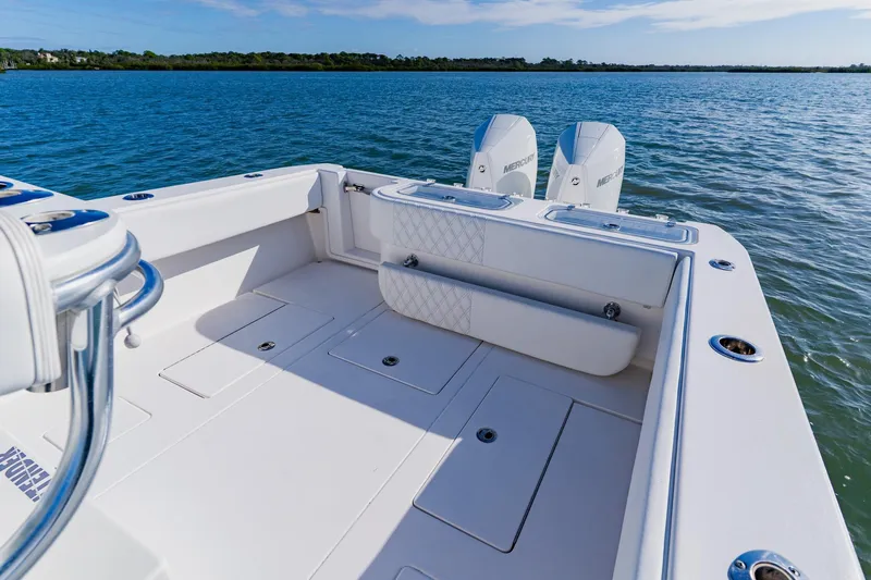  Yacht Photos Pics 2025 Contender 32 ST boat with dual Mercury engines on calm water.