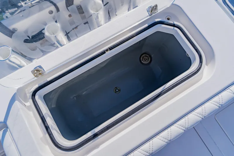  Yacht Photos Pics Contender 32 ST 2025 boat livewell, open lid, white interior, marine equipment.