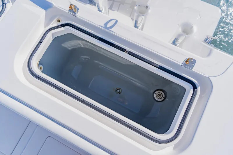  Yacht Photos Pics Livewell on 2025 Contender 32 ST boat, open lid, white interior.