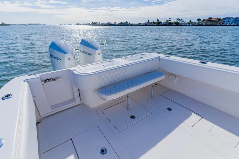  Yacht Photos Pics 2025 Contender 32 ST boat with dual Mercury engines on calm water.