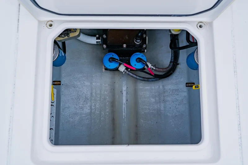  Yacht Photos Pics Contender 32 ST 2025 boat compartment with wiring and components.