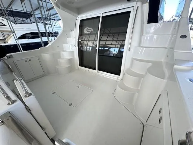 Why Knot Yacht Photos Pics 2003 Carver 410 Sport Sedan yacht deck with stairs and sliding glass doors.
