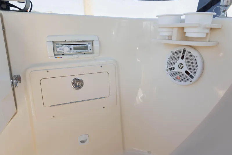 Figur'in It Out Yacht Photos Pics 2006 Mainship 400 Trawler interior with stereo system and speaker.