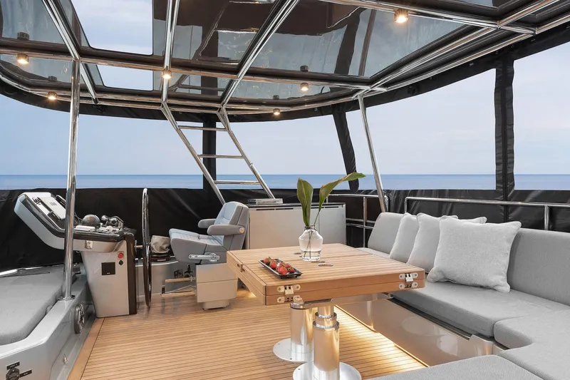  Yacht Photos Pics Luxurious Sunreef 50 yacht interior with modern seating, table, and ocean view, 2026 model.