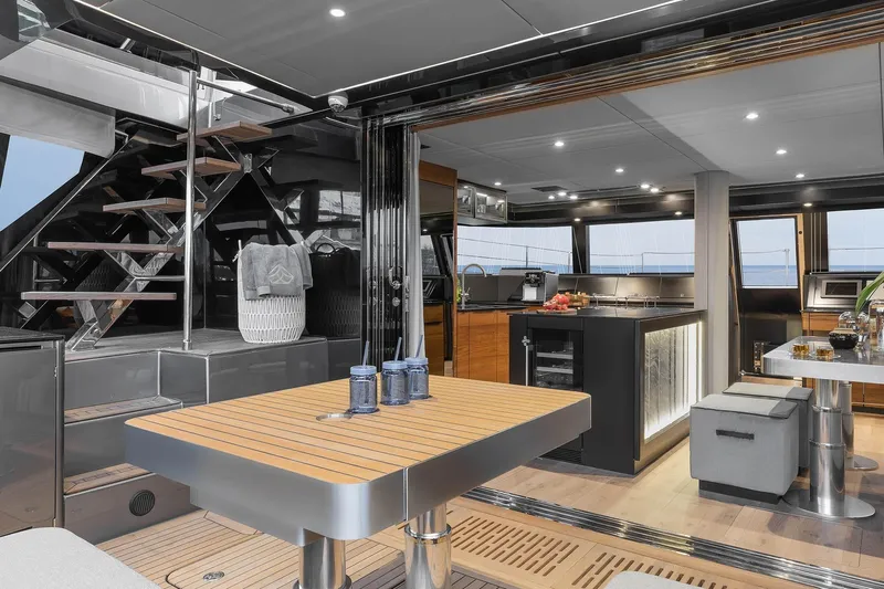  Yacht Photos Pics Luxurious interior of 2026 Sunreef 50 yacht with modern kitchen and dining area.