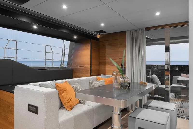  Yacht Photos Pics Luxurious interior of 2026 Sunreef 50 yacht with modern dining area and ocean view.