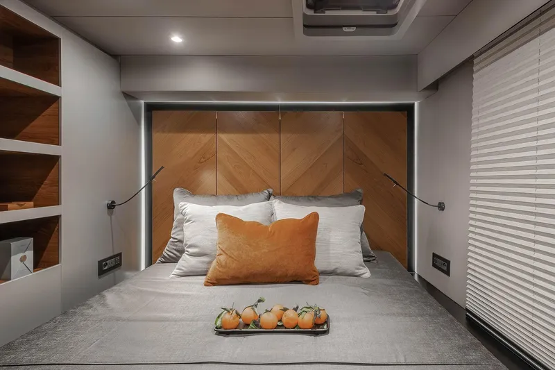  Yacht Photos Pics Luxurious Sunreef 50 yacht bedroom interior with elegant bedding and wooden accents, 2026 model.