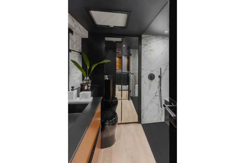  Yacht Photos Pics Luxurious bathroom interior of 2026 Sunreef 50 yacht with modern design and elegant finishes.