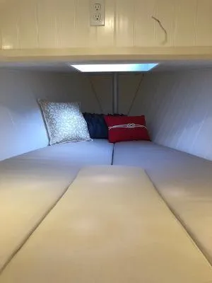  Yacht Photos Pics Cozy cabin interior of 2008 Gasparek Marine Eco Trawler with cushions and pillows.