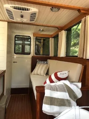  Yacht Photos Pics Interior of 2008 Gasparek Marine Eco Trawler with cozy seating and nautical decor.