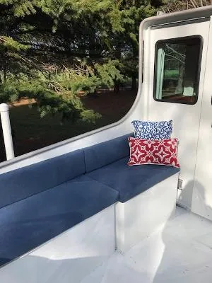  Yacht Photos Pics Custom 2008 Gasparek Marine Eco Trawler with blue seating and decorative pillows.